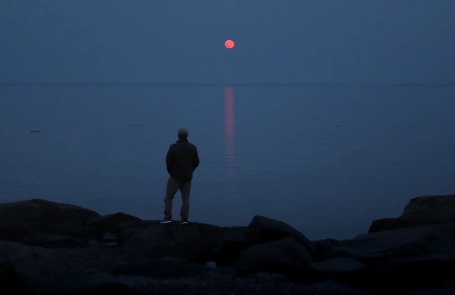 Light pollution and wildfire smoke dim the night sky for suburban stargazers