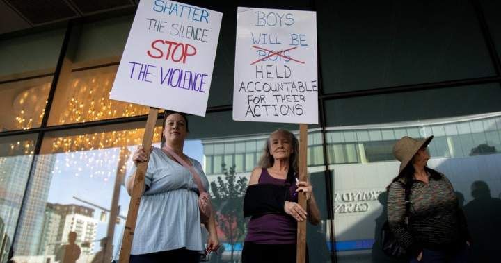 Protesters gather outside Rogers Place as Oilers face backlash over signing of acquitted player