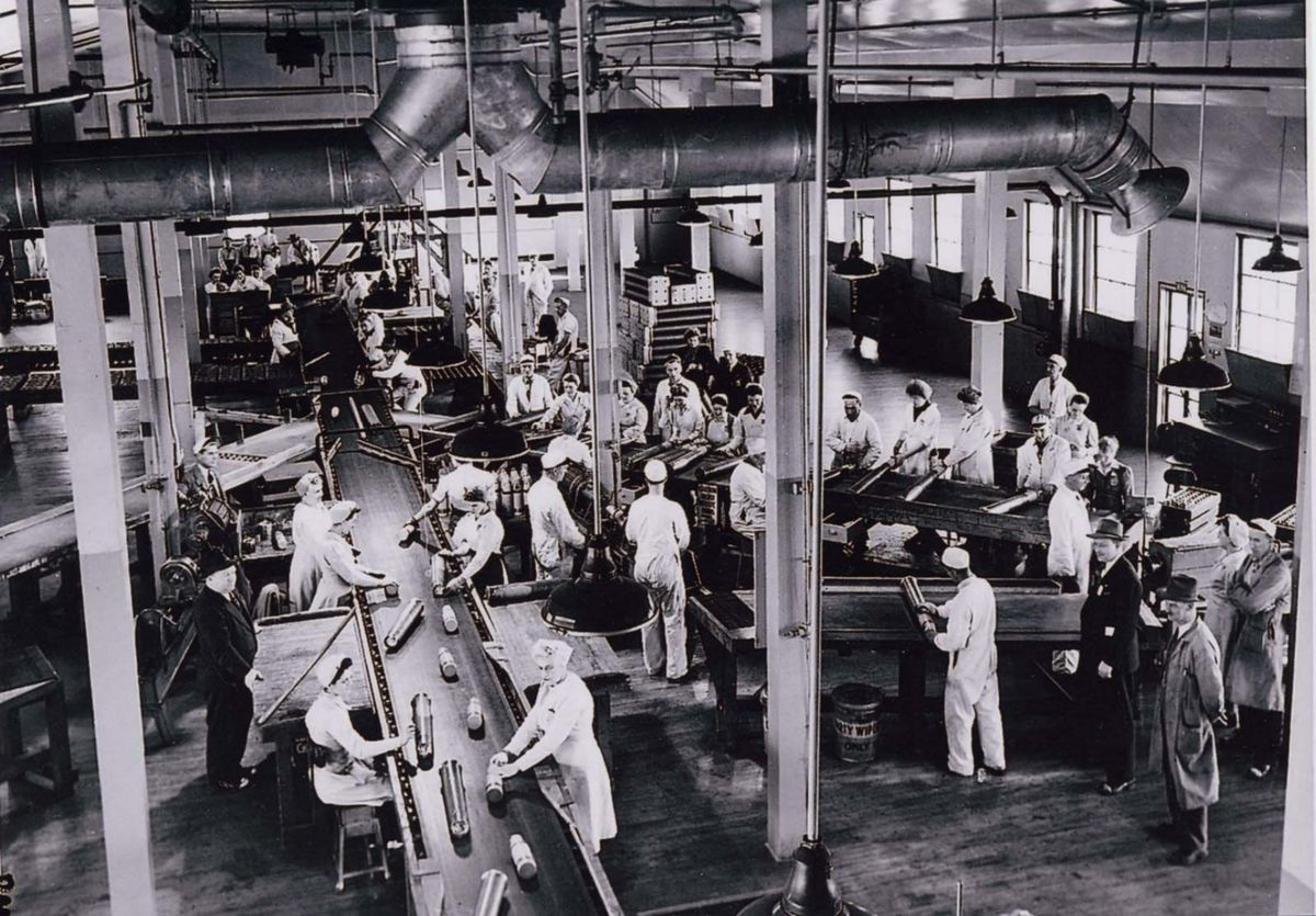 Line 3 workers assemble 3.7 calibre anti-aircraft shells at the Defence Industries Limited (DIL) Pickering Works plant in Ajax. These were t