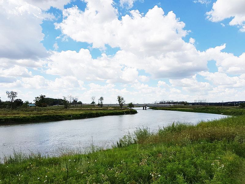 The Assinboine River looking upstream from the Riverbank Discovery Centre.