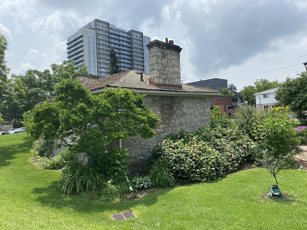 Back of McDougall Cottage in Galt with Gaslight Condos visible