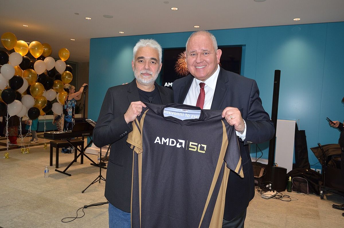 Markham mayor Frank Scarpitti (right) attending AMD 50th Anniversary at AMD Markham office; with Andrej Zdravkovic AMD Corp. VP, Software an