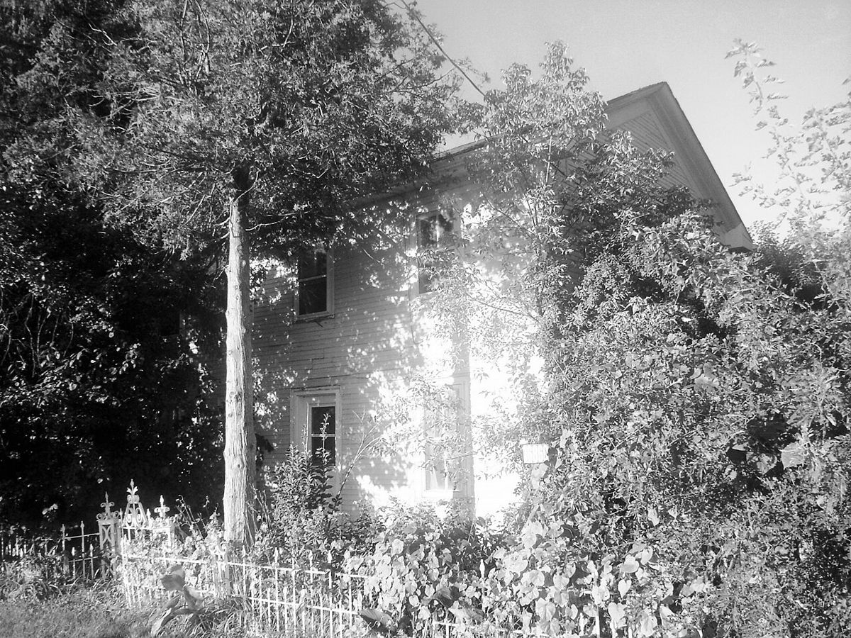Three-quarter view of the house, colours adjusted in GIMP and converted to black and white, to give an "old-time" feel to the picture. Given