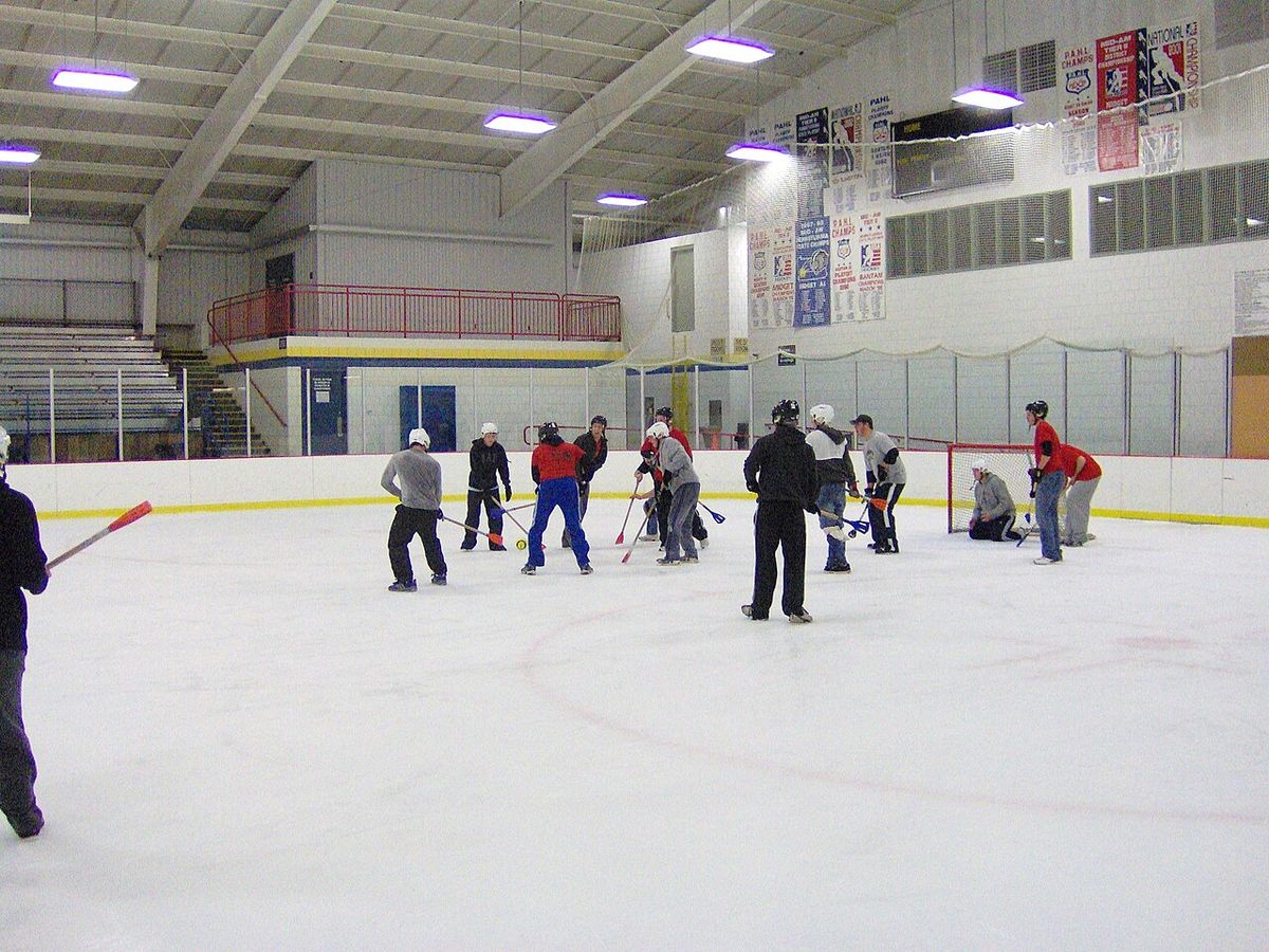 In-game picture of an informal game of broomball between college students. Unlike in more formal competitions, this game was played wholly i