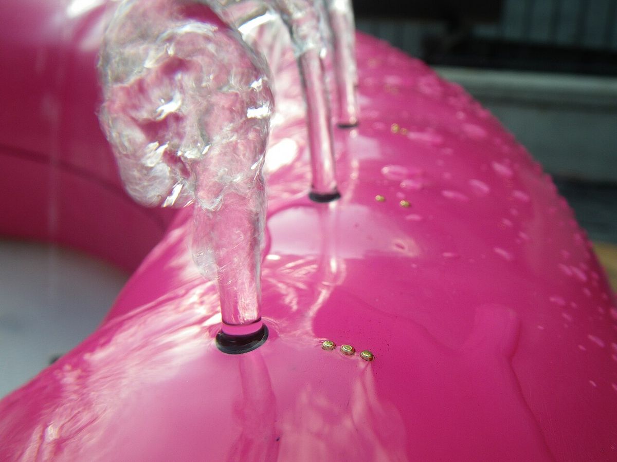 Picture of Braille markings above hydraulophone (underwater pipe organflute) water jet