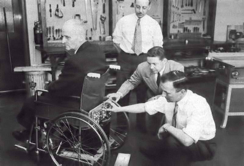 George Klein with others and his invention, the Klein electric wheelchair, at the National Research Council of Canada 1953.