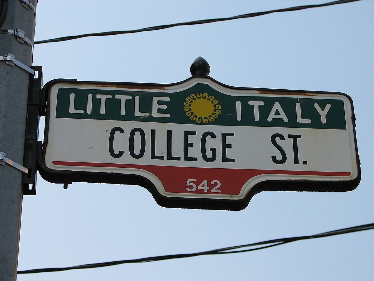 Photograph of a College Street sign in the Little Italy district of Toronto, Canada.