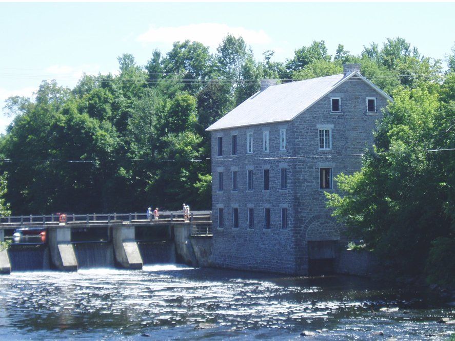 Watson's Mill on the Rideau River, located in the community of Manotick, in July 2005. Ottawa, Ontario, Canada.