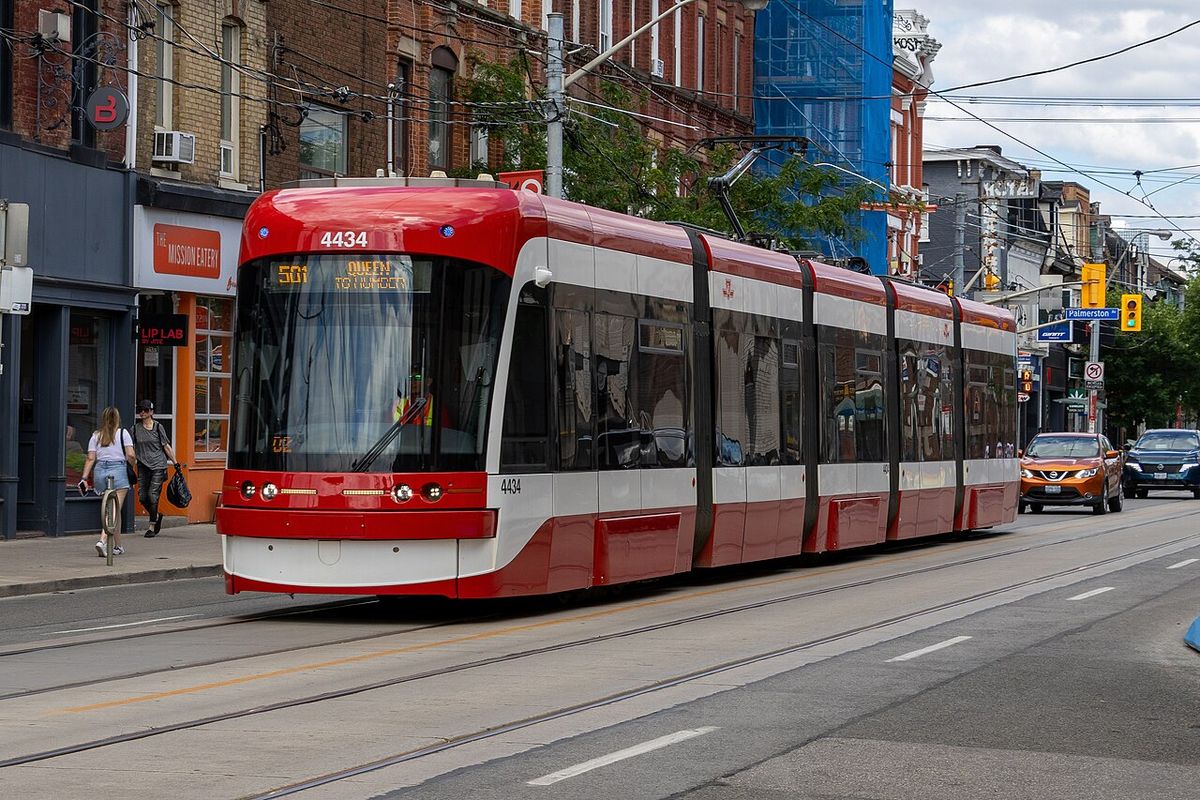 A 501 Queen streetcar travelling along Queen Street West