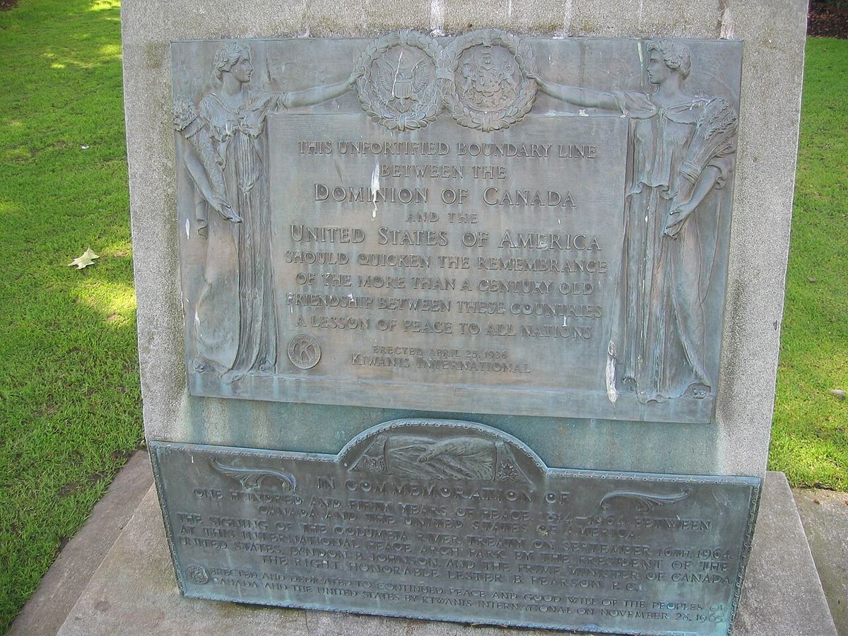 The international boundary plaque at Peace Arch Park. Surrey, BC, Canada/Blaine, Washington, USA.