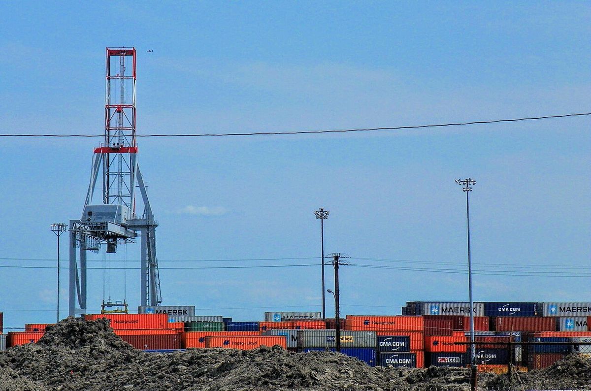 Crane and containers in the port of Montreal, seen from Notre-Dame street